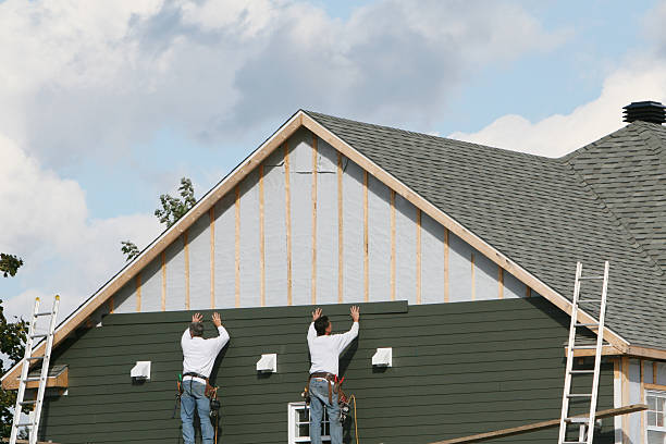 Professional Siding technician working in South Boston, MA